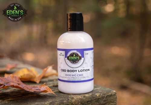 eden's herbals cbd lotion in a park during fall
